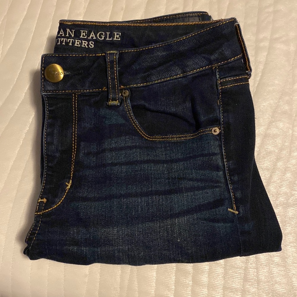 Dark washed blue AE skinny jeans